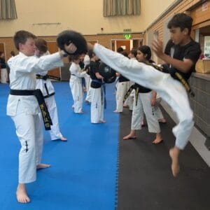 Black Belt Taekwon-Do student in Hitchin performing flying kick