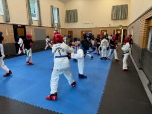Higher grade cadets Taekwon-Do students sparring at HSTS Hitchin class